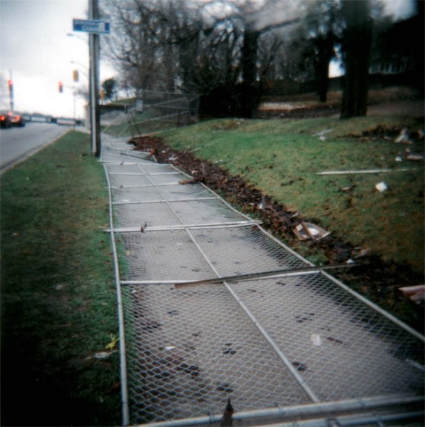 fence on sidewalk urban